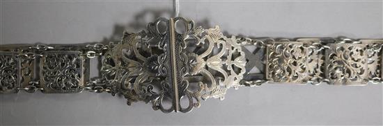 An Edwardian pierced silver belt, Birmingham, 1902 with three replacement metal links, 77cm.